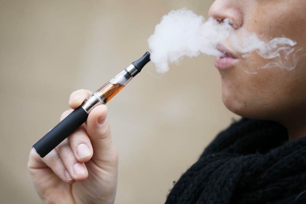 A person smoking an electronic cigarette. Photo: AFP