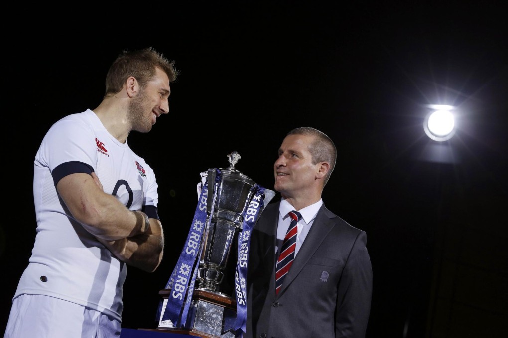 Skipper Chris Robshaw and Stuart Lancaster pose with the Six Nations trophy. Photo: AFP