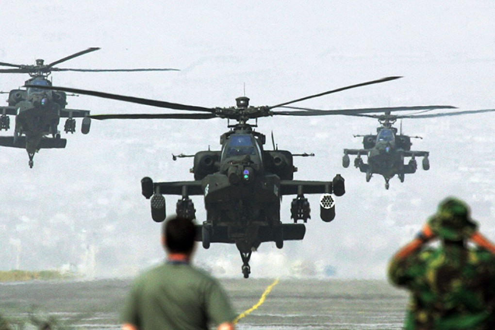 US Apache helicopters fly in formation at a base outside Kabul, Afghanistan. Photo: Reuters