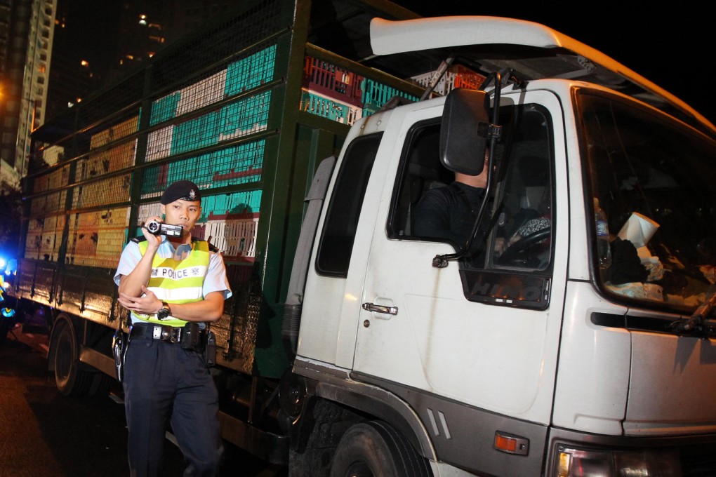 A chicken trader's truck stopped by police near Government House. Photo: Nora Tam