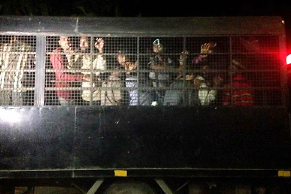 The dark side: ''Rescued'' Rohingya in Pedang Besar last night. Photo: Phuket Wan