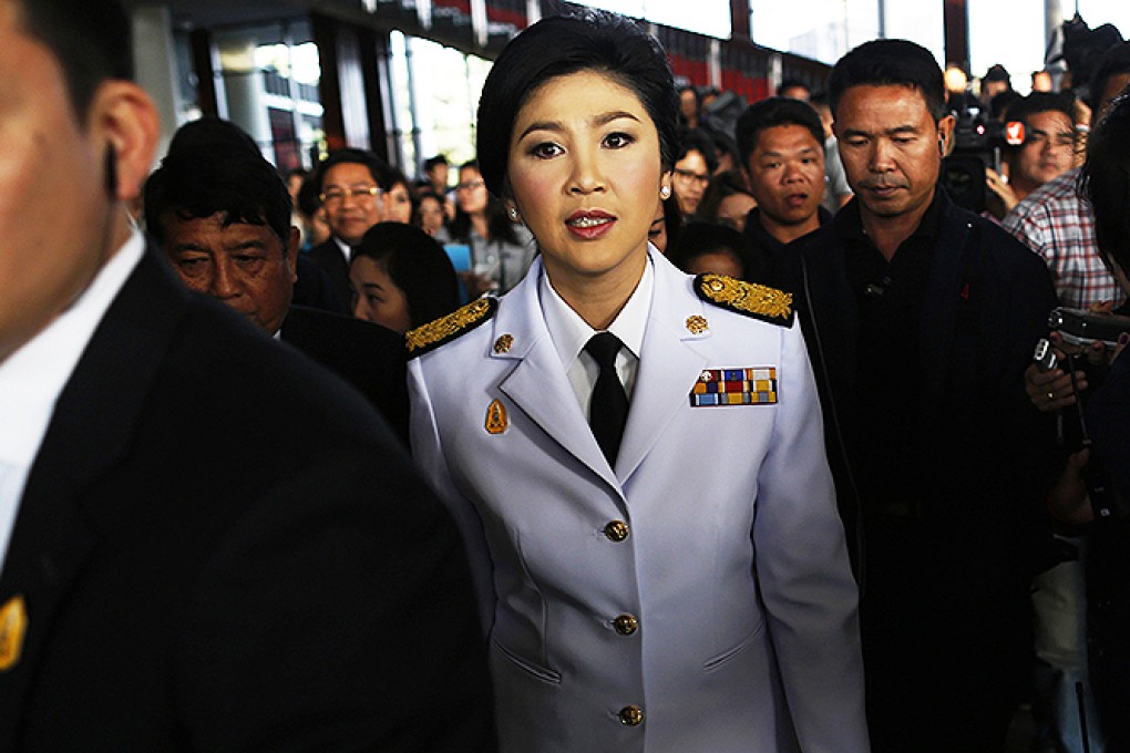 Thailand's Prime Minister Yingluck Shinawatra leaves the Army Club after meeting the Election Commission in Bangkok. Photo: Reuters