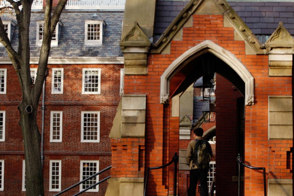 A student stands in the entrance-way of a building at Harvard University in Cambridge, Massachusetts. Photo: Reuters