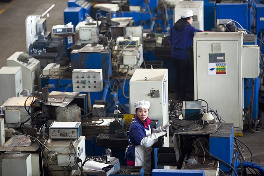 An employee works on a production line in Hangzhou. Photo: Reuters