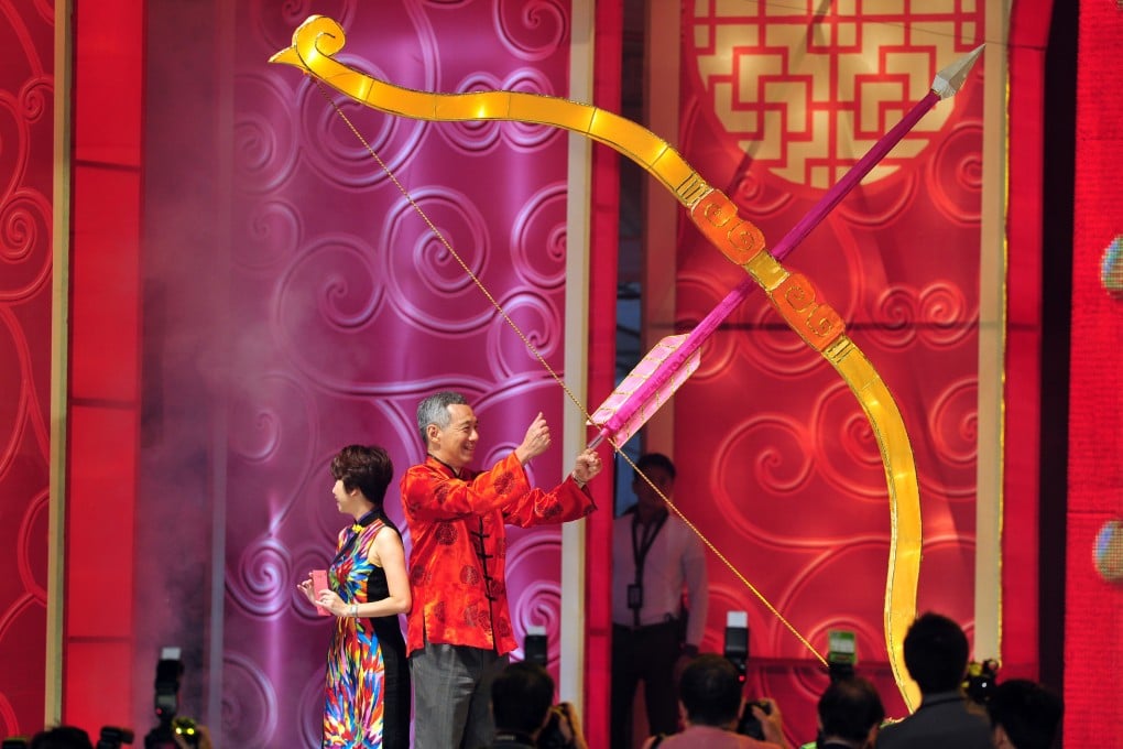 Singapore's Prime Minister Lee Hsien Loong attends a Lunar New Year celebration.  He has urged young couples to have more babies to boost flagging birth rates. Photo: Xinhua