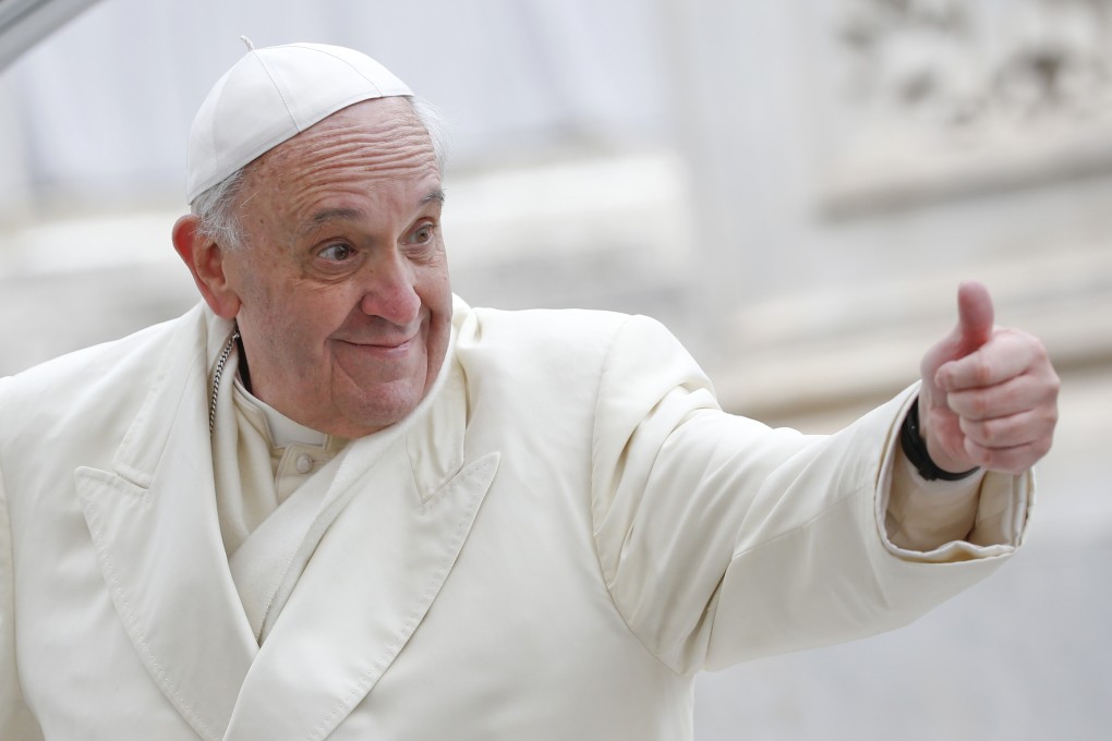 Pope Francis gestures to the crowd at St Peter's Square in the Vatican. Photo: Reuters