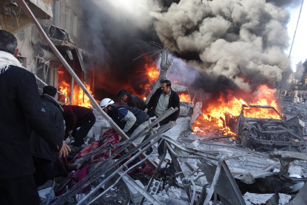 Medical personnel look for survivors following a reported airstrike on the Tariq al-Bab district in Aleppo. Photo: AFP