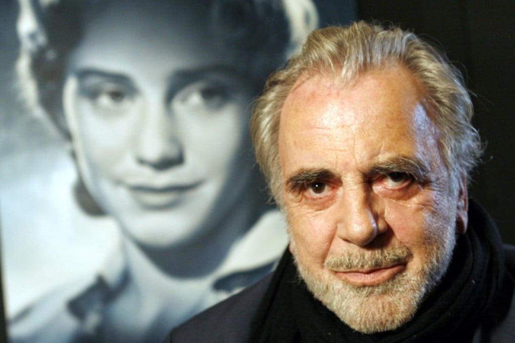Maximilian Schell poses in front of a poster of his sister Maria in Frankfurt, Germany in 2007. Photo: AP