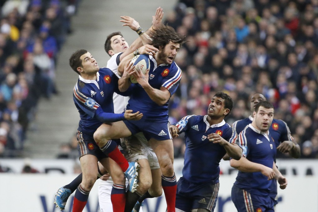 France's scrum-half Maxime Machenaud (C) catches the ball during the Six Nations rugby union match between France and England. Photo: AFP