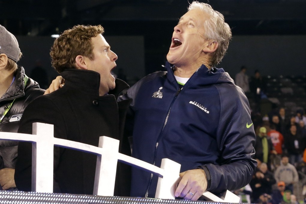 Seattle head coach Pete Carroll (right) celebrates with general manager John Schneider after winning Super Bowl XLVIII. Photo: AP