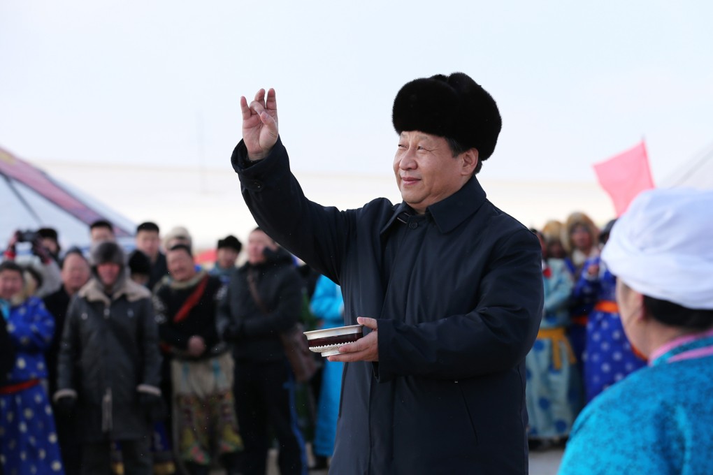 President Xi Jinping flicks three milk drops, a Mongolian new year blessing, in Xilinhot, Inner Mongolia Autonomous Region. Photo: Xinhua