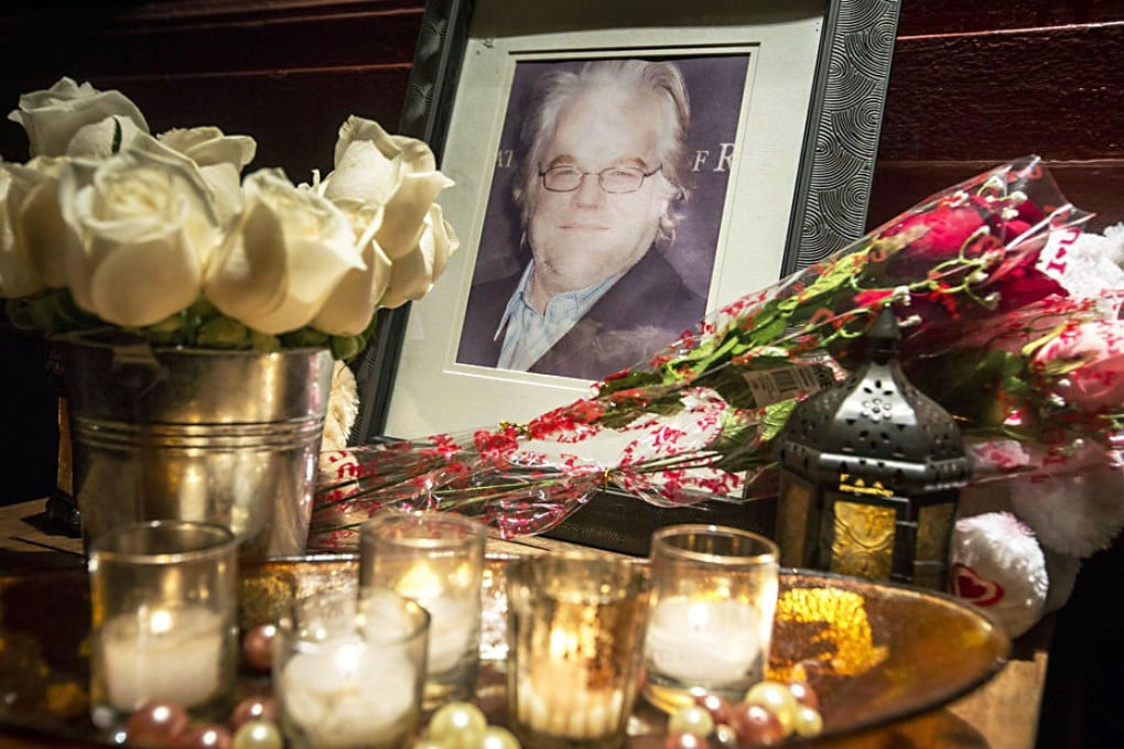 A makeshift memorial outside the New York apartment building where the body of Philip Seymour Hoffman was found. Photo: EPA