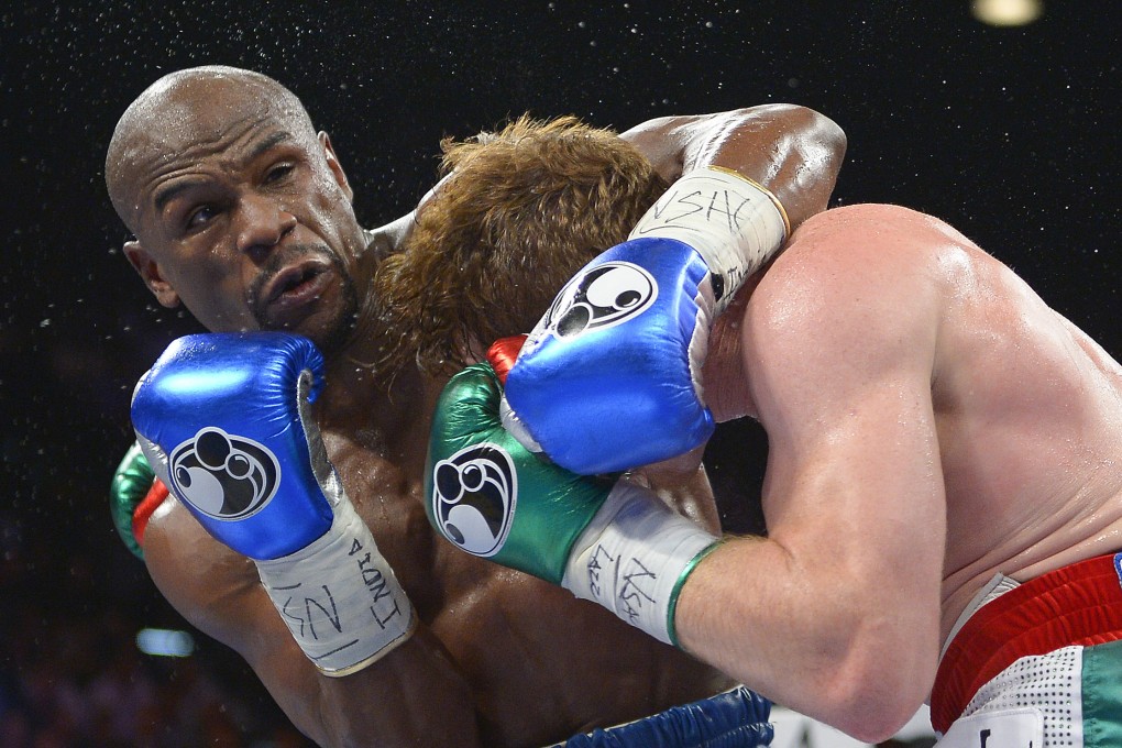 Floyd Mayweather in action against Canelo Alvarez. Photo: AP