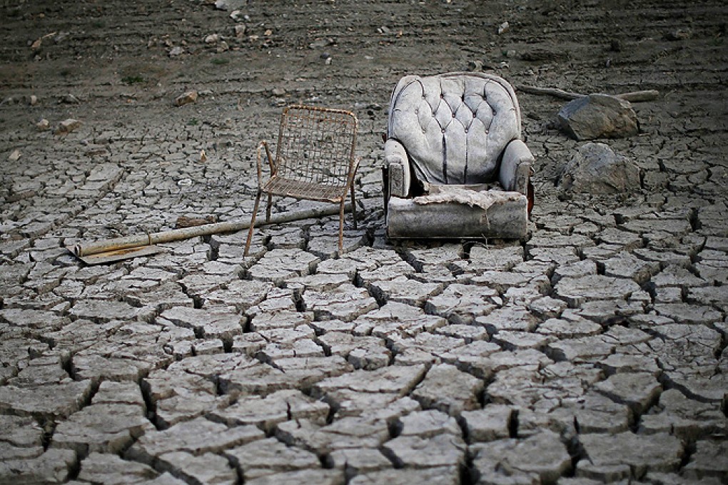 Discarded chairs sit on the dried and cracked bed of the Almaden Reservoir in San Jose, California. Photo: AFP