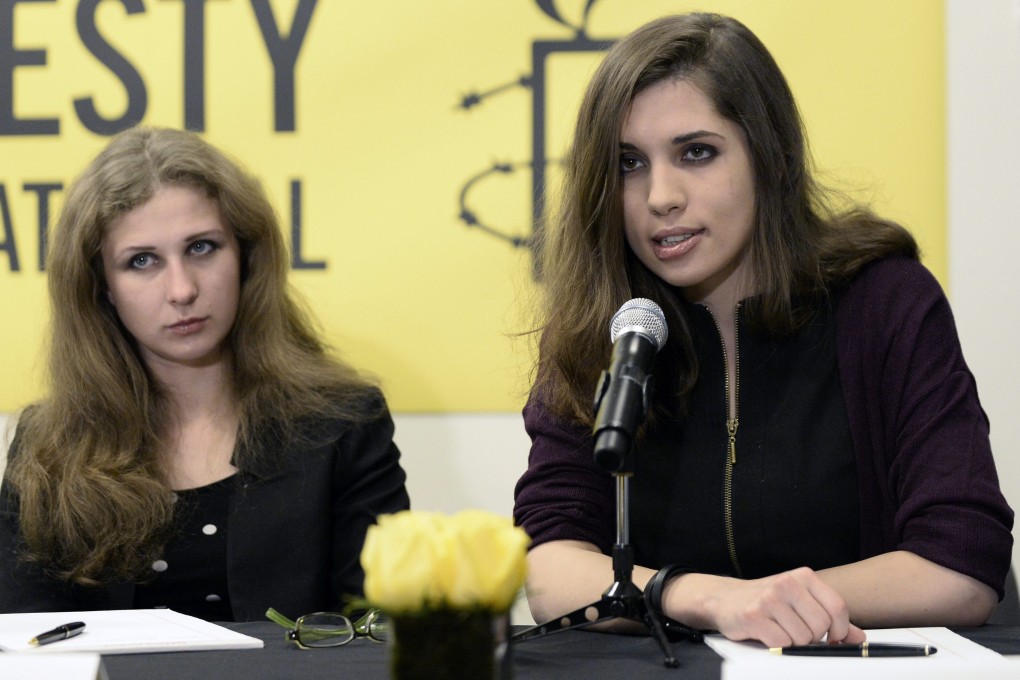 Maria Alyokhina (left) and Nadezhda Tolokonnikova, comprising two-thirds of feminist punk band Pussy Riot, at the Amnesty International press conference. Photo: EPA