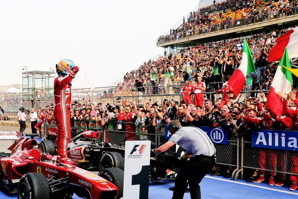 Spanish Formula One driver Fernando Alonso celebrates after winning the 2013 Chinese Formula One Grand Prix at the Shanghai International circuit in Shanghai on April 14, 2013. Photo: EPA