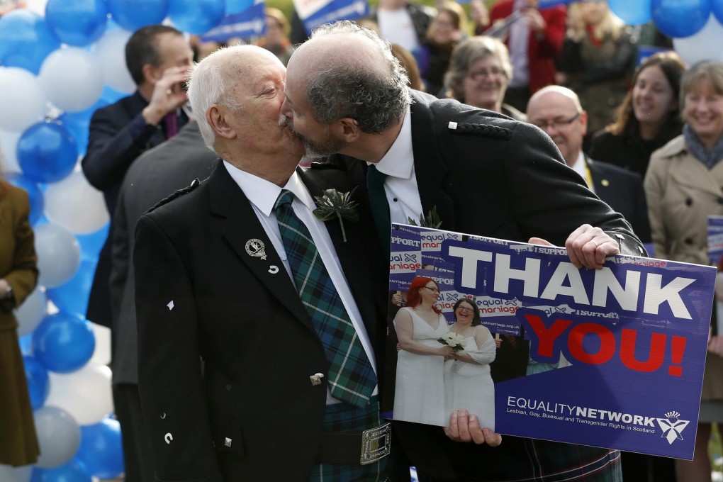 A symbolic same-sex marriage takes place outside the Scottish Parliament on Tuesday. Same-sex marriage is opposed by church and other religious groups. Photo: Reuters