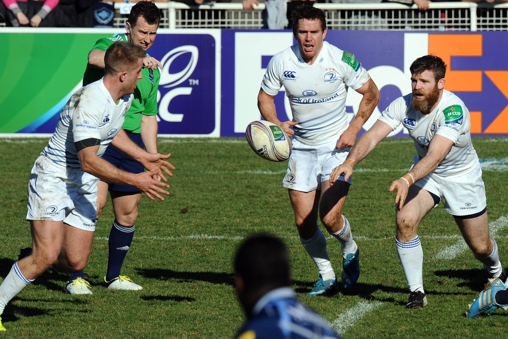 Centre Gordon D'Arcy (right), seen playing for Leinster, returns to the Ireland side for the Six Nations match against Wales. Photo: AFP