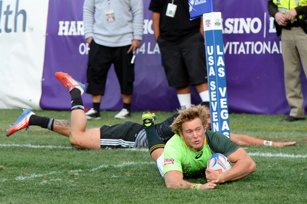 Werner Kok of South Africa scores the match-winning try against New Zealand in the USA Sevens Cup final. Photo: AFP