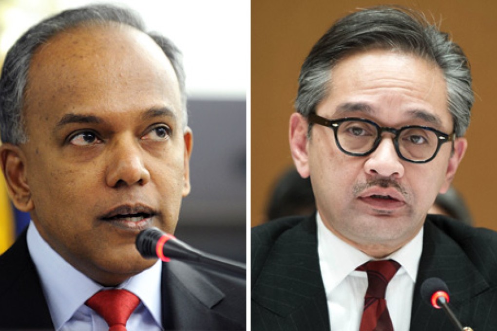 Singapore's Foreign Minister K. Shanmugam (left) and his Indonesian counterpart Marty Natalegawa. Photos: AFP