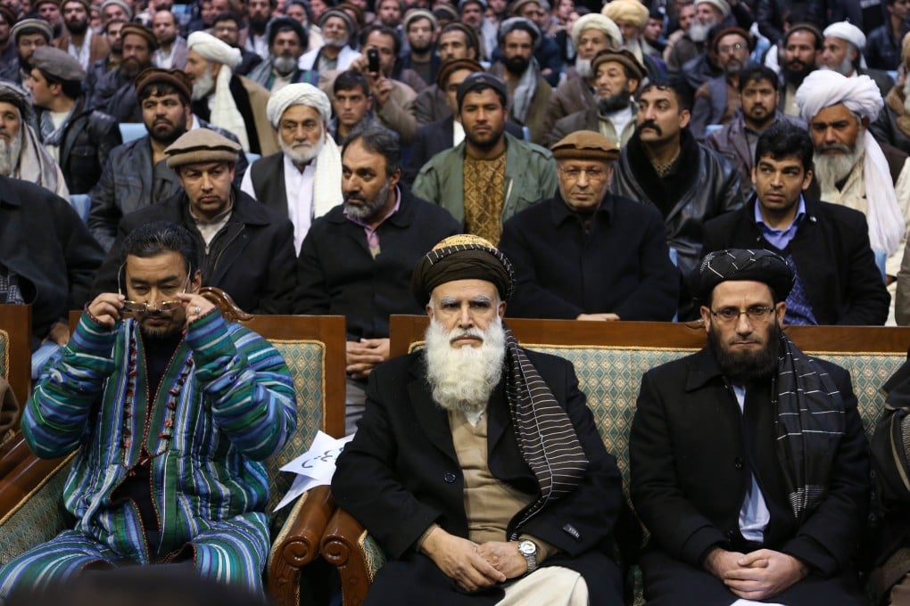 Afghan presidential candidate Abdul Rab Rasoul Sayyaf (front, centre) attends a campaign rally in Kabul. Photo: AP