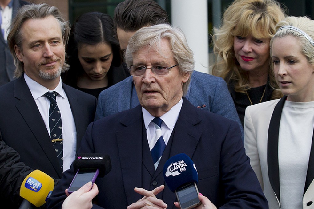 British actor William Roache (centre), talks to the press in Preston, England on Thursday after being found not guilty on sexual offences charges. Photo: AP