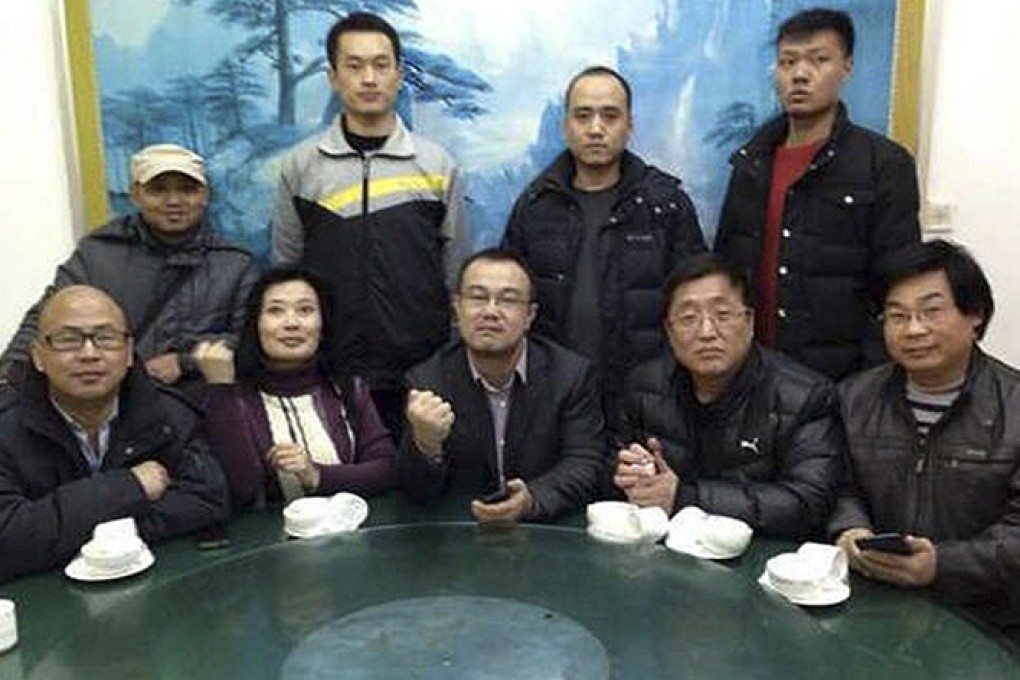 Activists convene to demand an investigation into the death of Xue Fushun, a fellow activist’s father, in Qufu on Friday. Photo: AP