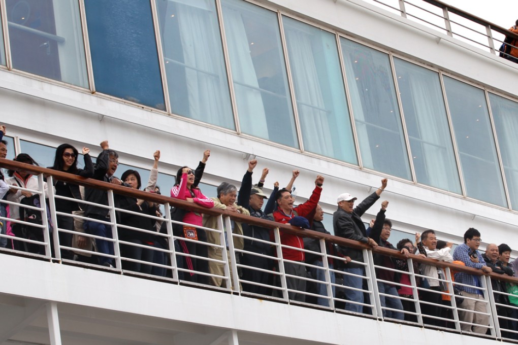 Passengers refuse to leave the Costa Victoria in a row over compensation for missing a stop in Ha Long Bay. Photo: Edward Wong