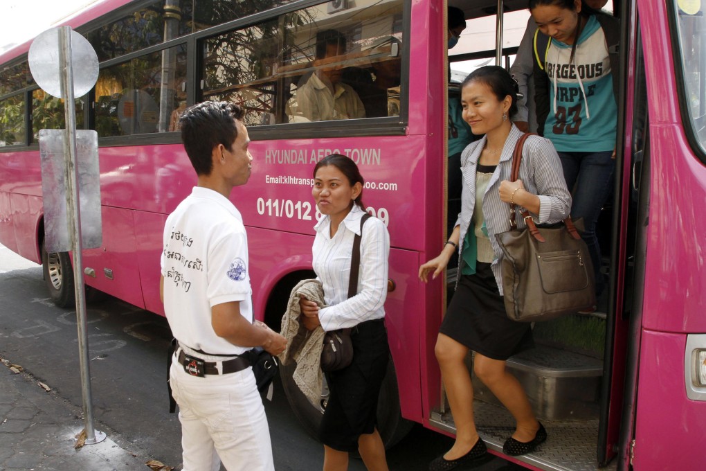 Cambodians try out their new bus service. Photo: AP
