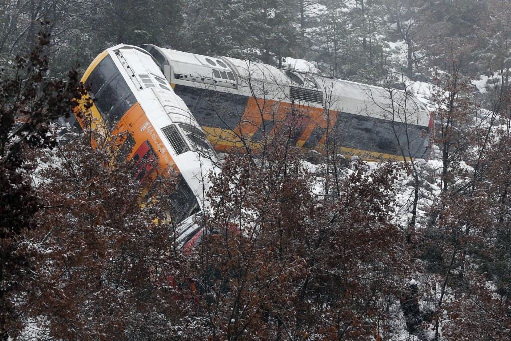 Derailed carriages lying on the snow-covered slope. Photo: EPA