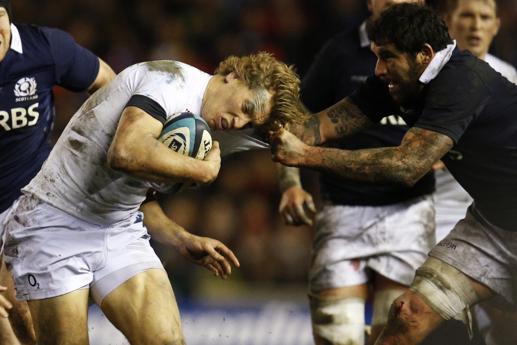 Scotland’s Jim Hamilton tackles Billy Twelvetrees of England during their Six Nations match at Murrayfield on Saturday. Photo: Reuters