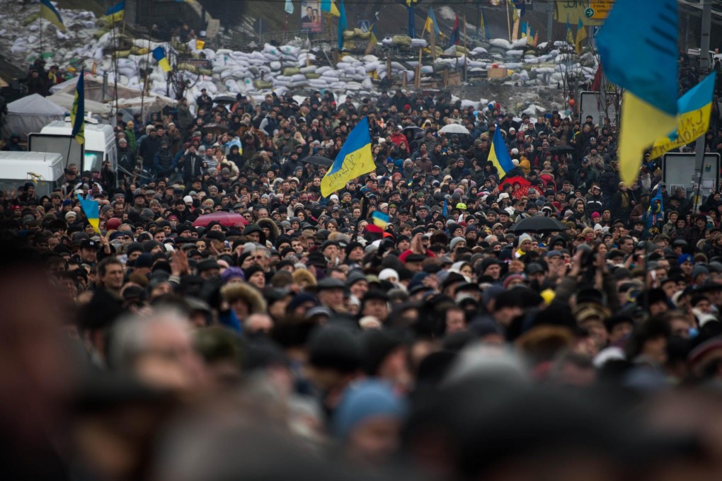 A few of Ukraine's yellow and blue flags appear at this pro-European Union rally in Kiev. Yellow and blue are also the EU colours. Photo: AFP
