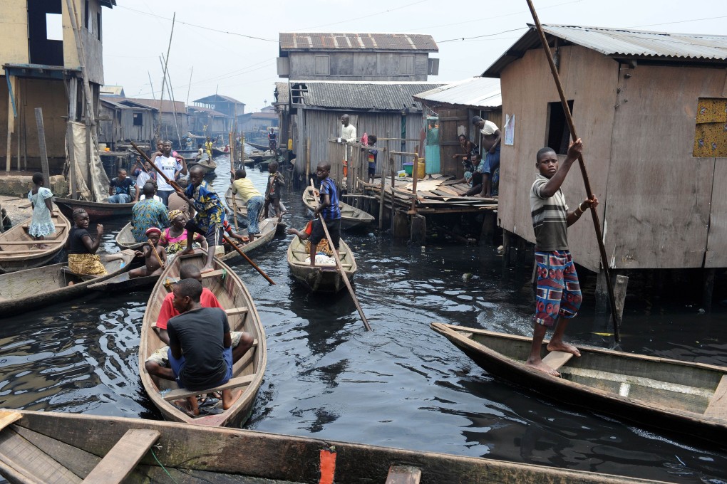 People navigate through the waterways of the Makoko slum in Lagos. Photo: AFP