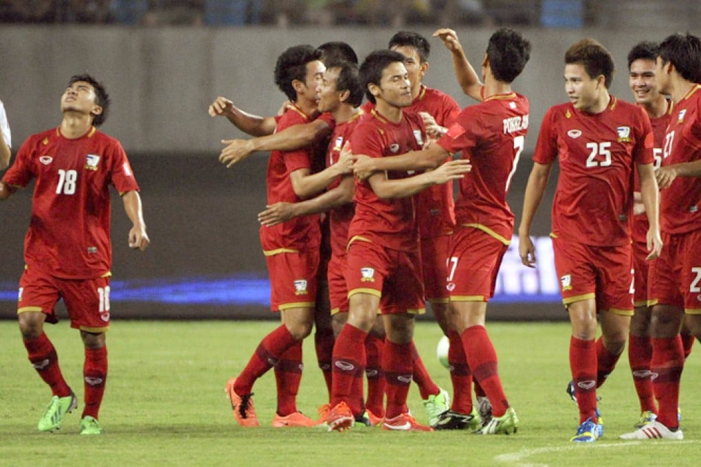 Thailand players celebrate a goal during their 5-1 defeat of China in June that triggered outcry to improve the national team. Photo: AP
