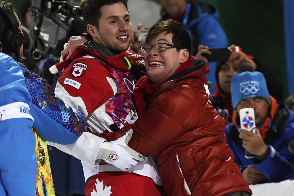 Canada's Alex Bilodeau embraces his brother after winning gold. Photo: Reuters