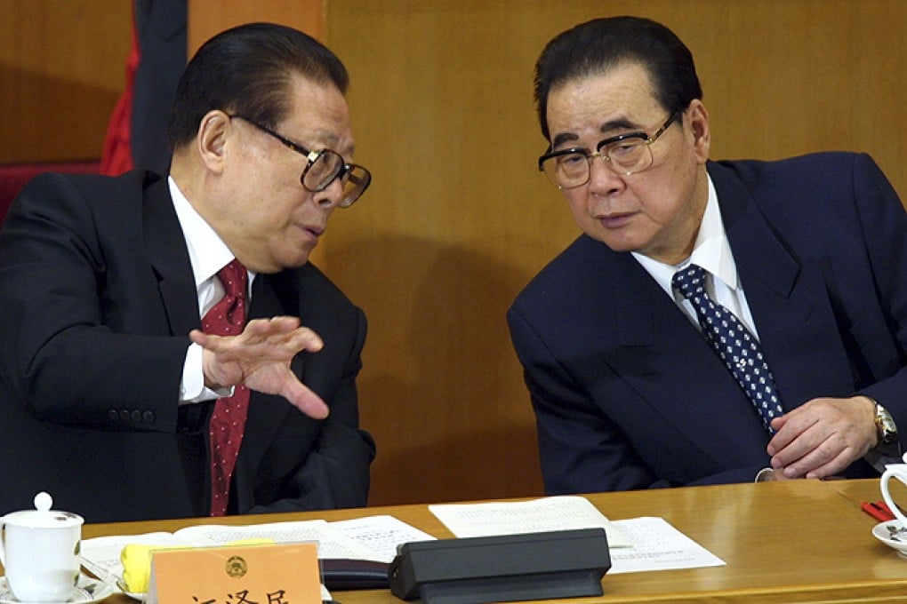 Former president Jiang Zemin (left) talks with former prime minister Li Peng at the Great Hall of the People in Beijing in this 2002 file picture. Photo: Reuters