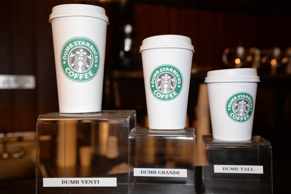 "Dumb" venti, grande and tall cups are displayed inside "Dumb Starbucks" coffee shop. Photo: AFP