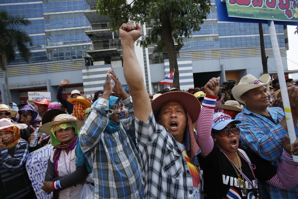 A rice farmer reacts during a protest demanding payment of rice subsidies. Photo: AP