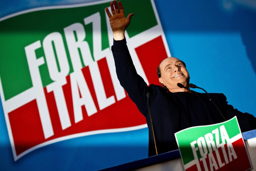 Italy's former Prime Minister Silvio Berlusconi delivers a speech outside Palazzo Grazioli, his private Rome residence, in November. Photo: EPA