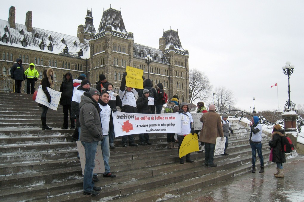 Protesters seen outside Canada's parliament in Ottawa in January demanding their permanent residency applications to be fast-tracked. Photo: AP