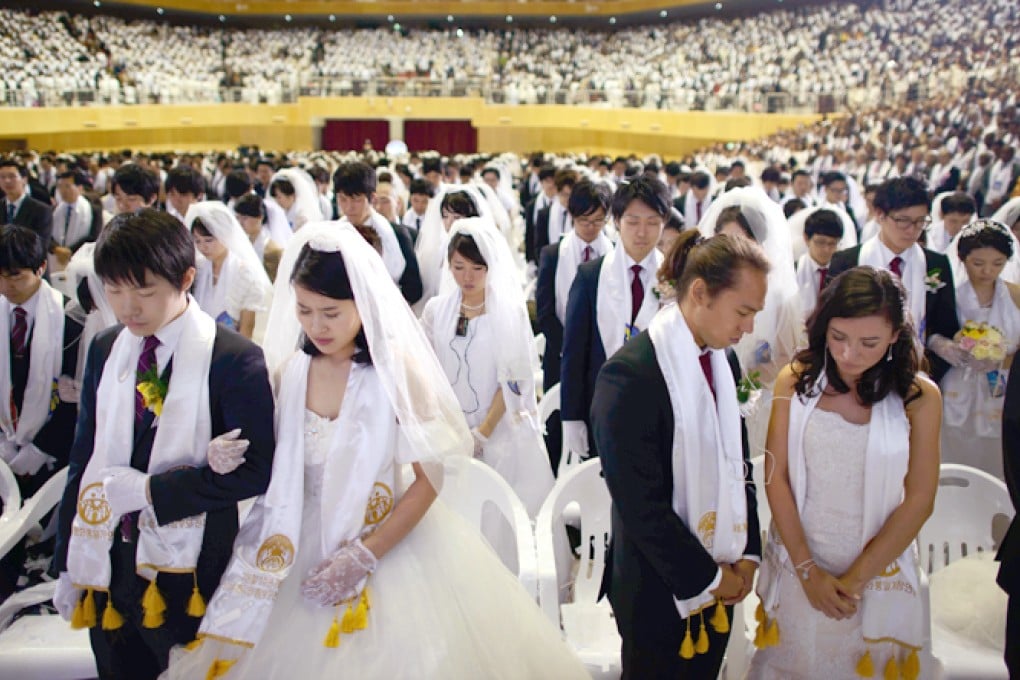 Couples attend a mass wedding at an event held by the Unification Church in Gapyeong. Photo: AFP