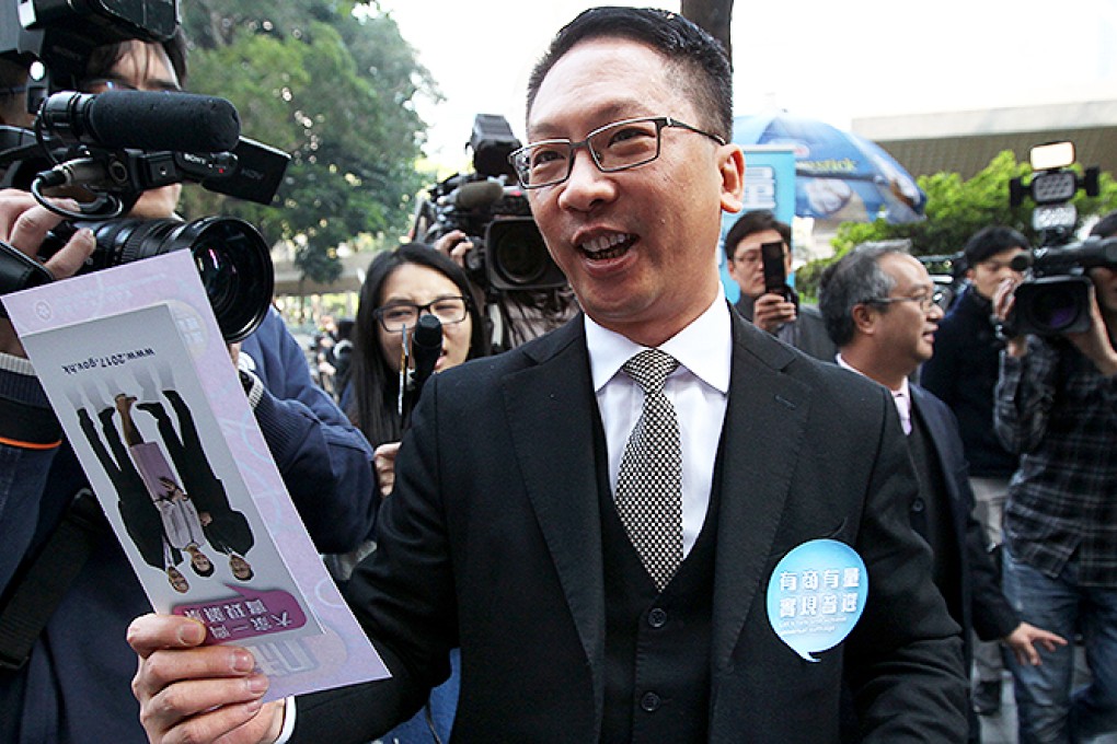 Rimsky Yuen distributes leaflets on a five-month public consultation on political reform in Central. Photo: Nora Tam