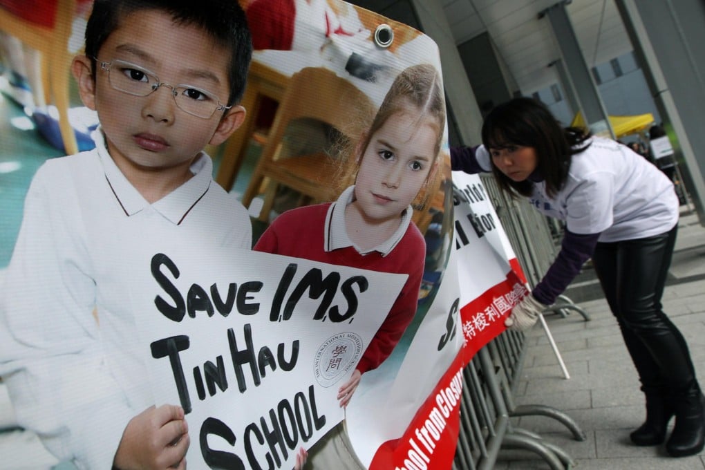 Parents of International Montessori School pupils put up a banner outside government offices seeking help with its lease. Photo: Nora Tam