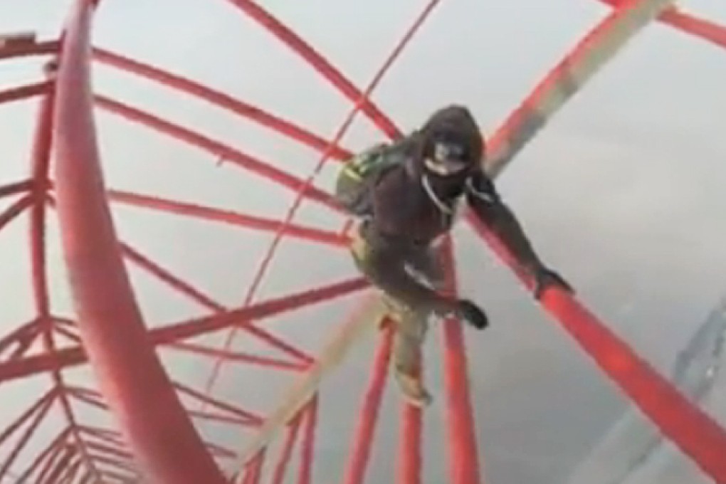 The two climbers walked up stairs, climbed ladders and finally scaled a crane at the top of the Shanghai Tower. Photo: SCMP Pictures