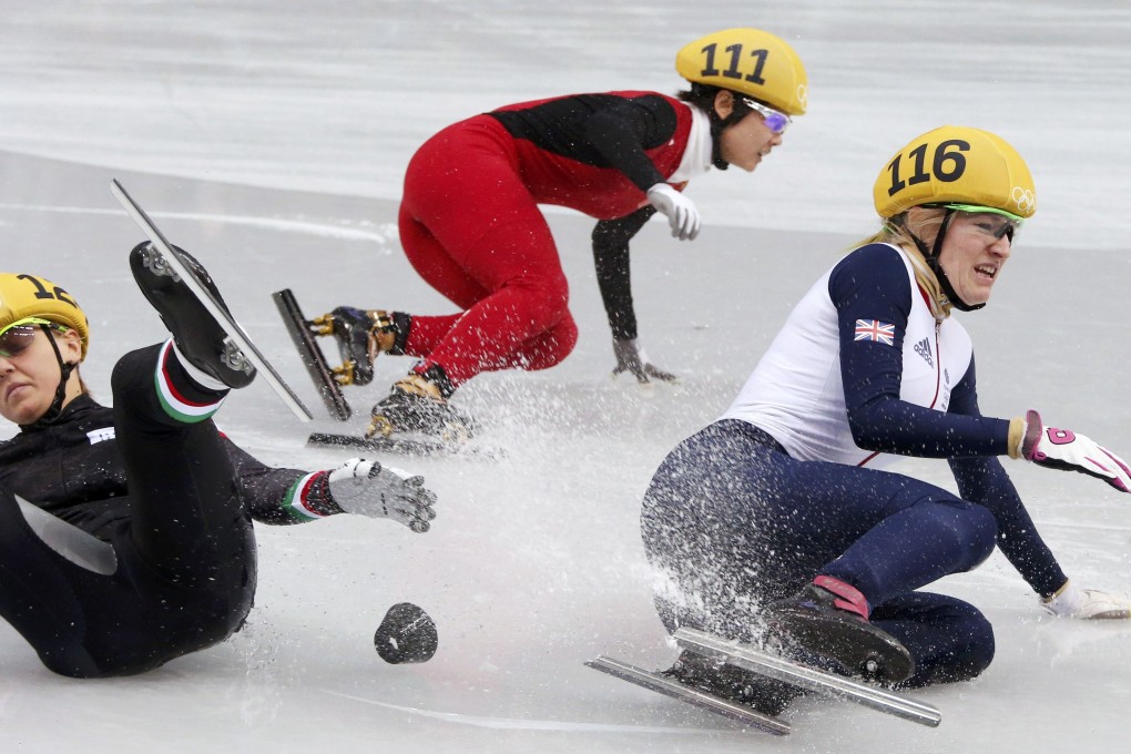 China's Li Jianrou skates to a first place finish as Italy's Arianna Fontana (left) and Britain's Elise Christie crash during the women's 500 metres short track speed skating final at the Iceberg Skating Palace. Photo: Reuters