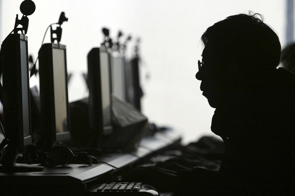 Man uses a computer at an internet cafe in Shenyang in northern China's Liaoning province. New regulations say civil servants in the district should not watch, collect or spread pornographic videos and publications. Photo: AP