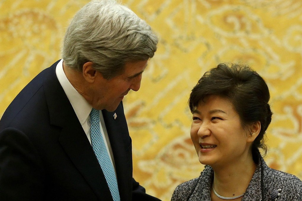 US Secretary of State John Kerry is greeted at the Blue House in Seoul by South Korean President Park Geun-hye. Photo: EPA