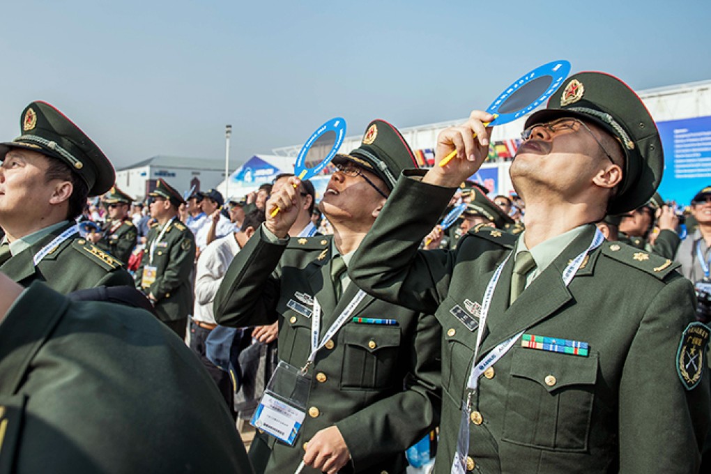 PLA Air Force officers attend the China International Aviation and Aerospace Exhibition in Zhuhai. Photo: AFP