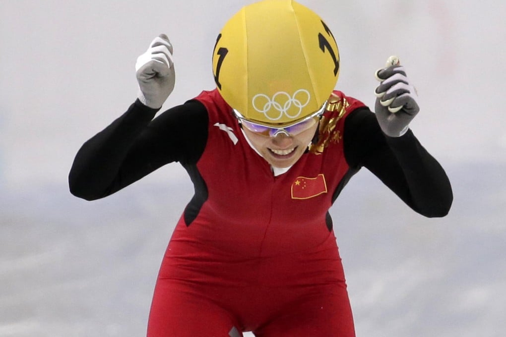 Li Jianrou reacts as she crosses the finish line to win the women’s 500m short track speed skating final at the Iceberg Skating Palace. She won China's first gold at Sochi. Photo: AP