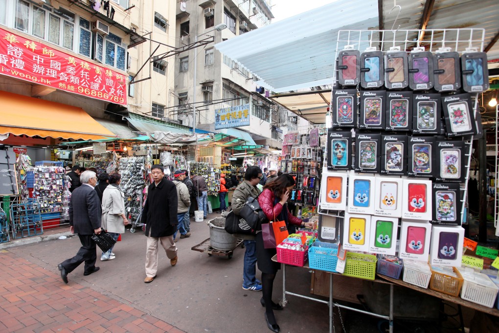 Apliu Street in Sham Shui Po. Police say a 40-year-old man allegedly posed as a plain-clothed policeman to steal mobile phones from four young people in Sham Shui Po and North Point. Photo: Edmond So